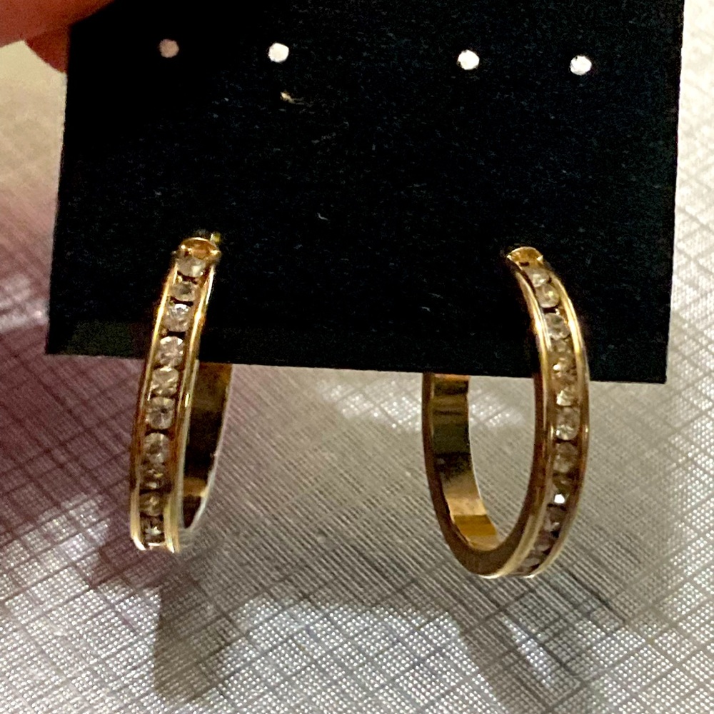 Gold-tone channel-set hoops with white gemstones